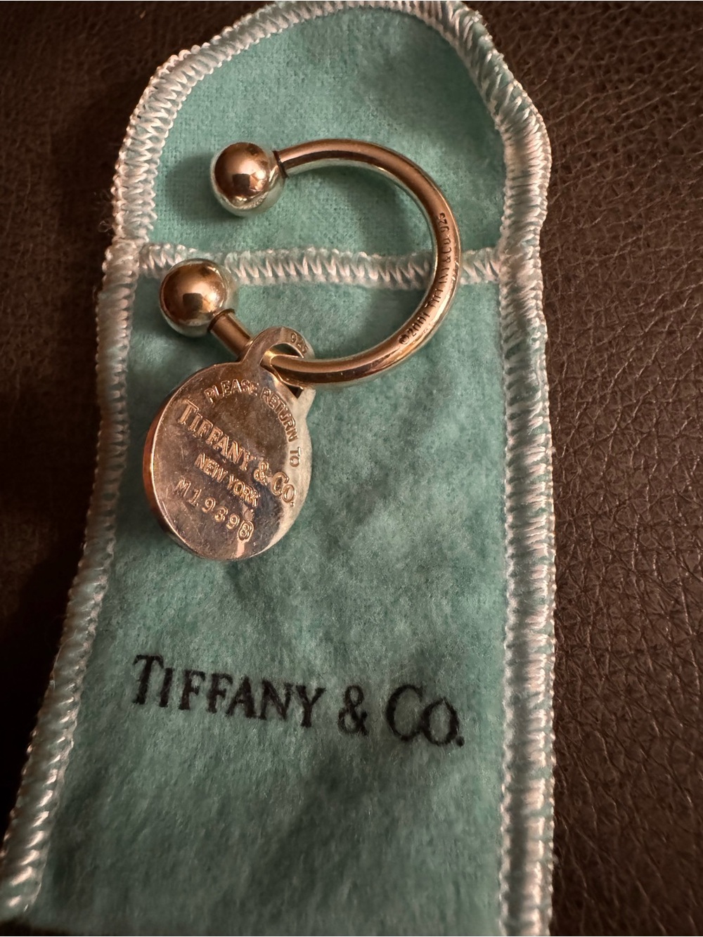 Tiffany & Co. Silver Bean Key Ring with Round Tag on Blue Pouch